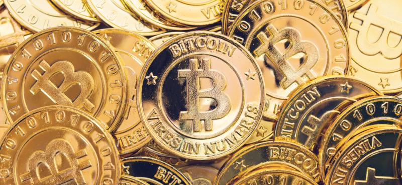 Collection of gold coloured Bitcoin coins featuring the Bitcoin symbol, representing cryptocurrency investing, digital assets, blockchain technology, and virtual currency markets.