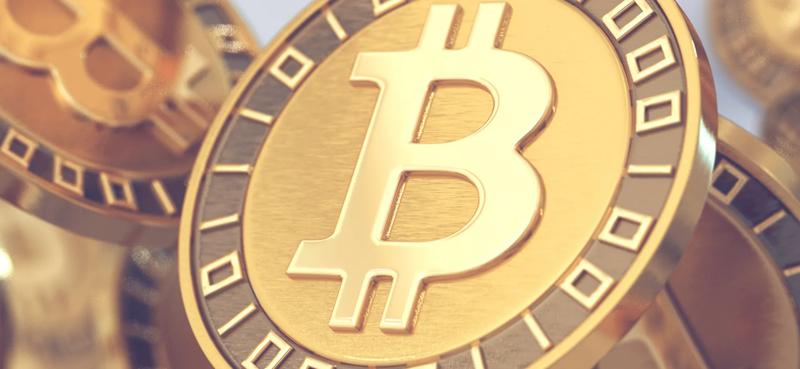 Close up view of gold Bitcoin cryptocurrency coins featuring the Bitcoin symbol, representing digital assets, blockchain technology, cryptocurrency investing, and virtual currency markets.