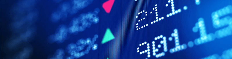 Close-up of a digital data display showing numerical values with upward and downward directional indicators