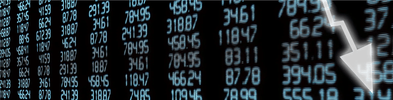 Digital stock market display showing columns of numerical data and a downward arrow indicating falling market values.