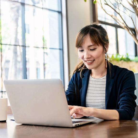 Trading on a laptop in bright room