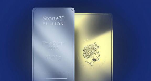 Two StoneX Bullion precious metal bars displayed side by side, showing a silver bar labeled “Fine Silver 999.9 – 1000 g” and a gold bar with an engraved profile, set against a blue background.