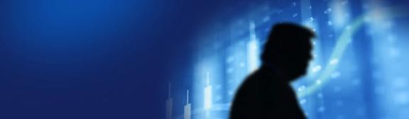 Silhouette of a person against a blue background with financial charts and upward trends. Abstract design symbolizes economic policies and market impact.