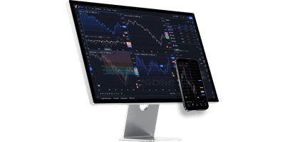 TradingView dashboard with multiple financial charts on desktop monitor and smartphone