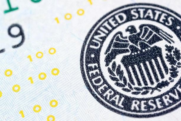Close up of the United States Federal Reserve seal printed on currency.