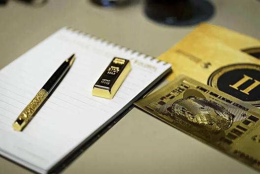 Investment plan with gold bar and gold notes