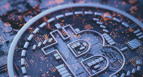 Close‑up of a Bitcoin symbol embedded in a digital circuit board, representing blockchain technology and cryptocurrency infrastructure.