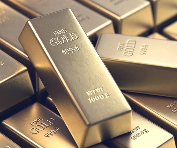 Stacked fine gold bars labeled 999.9 purity and 1000g weight