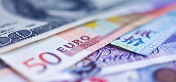 Close up of various international bank notes including 50 Euro note and £20 note